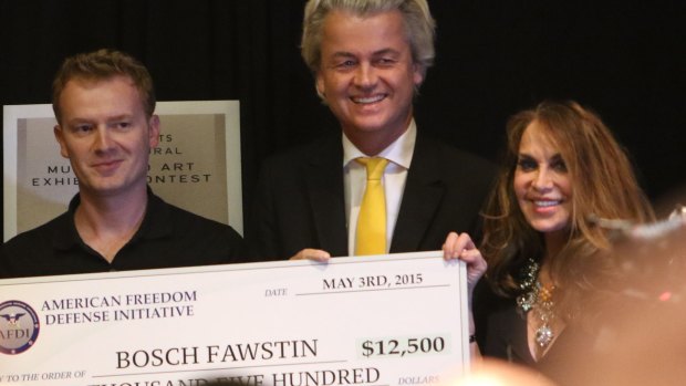 Artist Bosch Fawstin, left, is presented with a check by Dutch politician Geert Wilders, centre, and Pamela Geller, right, during the American Freedom Defense Initiative program that was marred by a shooting. 