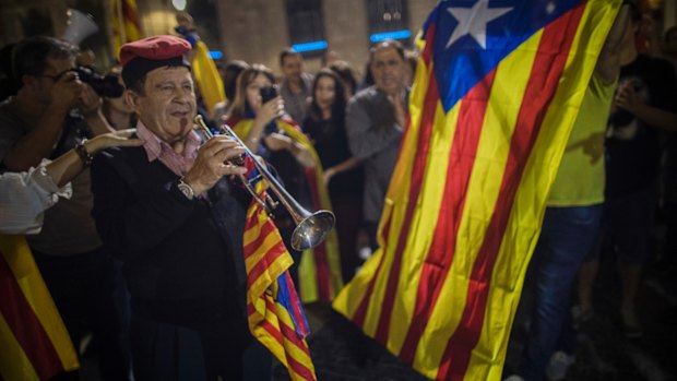 People gather in front of the Palau Generalitat in Barcelona, Spain awaiting for Catalan President Carles Puigdemont's speech.