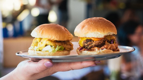 Calamari slider (left) and double bacon cheeseburger sliders at Slider Diner. 