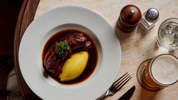 Sausages with potato puree and beef jus is among the classic pub dishes that dominate the menu.
