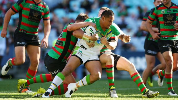 South Sydney try to bring down Raiders centre Joey Leilua.