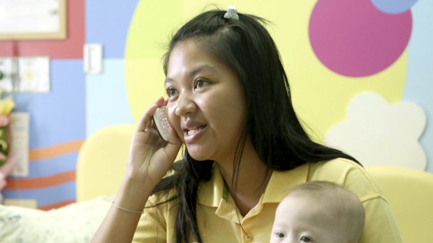 Pattaramon Chanbua, 21, with her son Gammy in 2014. The Baby Gammy scandal led to Thailand closing surrogacy clinics across the nation and driving clients to Cambodia. 