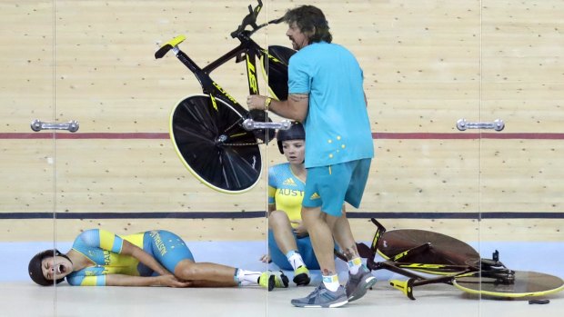 Horror start: Mel Hoskins cries out in pain after a training crash at the Rio velodrome.