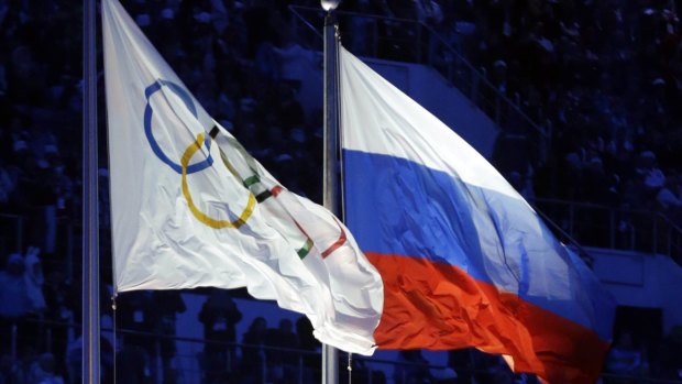 The Russian and Olympic flags fly at the tainted Sochi winter Olympics.