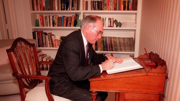 John Howard signs a condolence book for the late Diana, Princess of Wales at the Governor General's House Canberra.