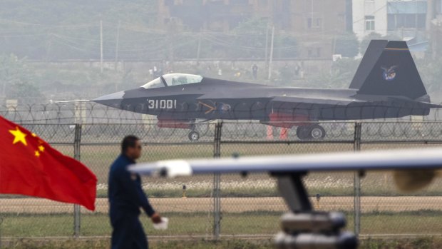 More weapons: A J-31 stealth fighter of the Chinese People's Liberation Army Air Force lands on a runway after a flying performance at the 10th China International Aviation and Aerospace Exhibition in Zhuhai, Guangdong.
