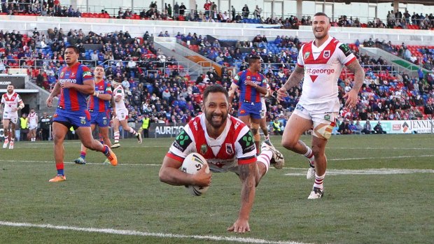 Magic touch: Benji Marshall scores during his star turn for the Dragons against Newcastle at Hunter Stadium.