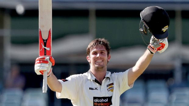 In the runs: Mitchell Marsh celebrates a century against Queensland.