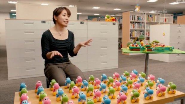 Software planner Emi Watanabe talks about her work on Yoshi's Wooly World. The plush, knitted amiibo toys were inspired by her attempt to mock up a real woollen Yoshi because he lacks the appropriate skills to create one in-game.
