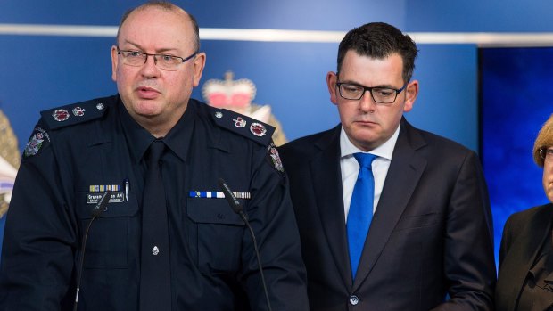 Chief Commissioner Graham Ashton with Premier Daniel Andrews after June's Brighton shooting. Ashton is due back on duty in mid-January.