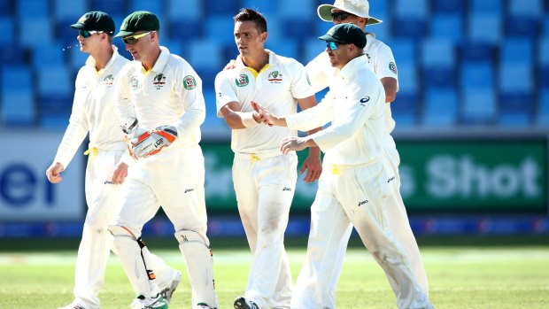 O'Keefe is congraulated by teammates after the wicket of Yasir Shah.