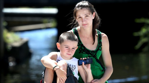 Dayna Alldridge and her son Tyler, six, whose phone has been receiving texts from random numbers requesting sexual favours.