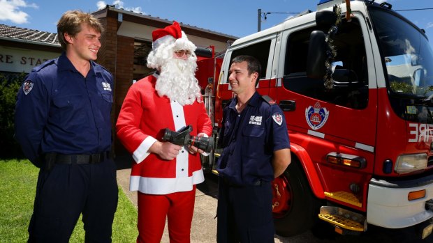 Life-saving Santa team: Bill Rowles, Nick Carey and Grant Morgan outside theTelarah fire station in Maitland. 
