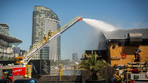 Firefighters battle the blaze at the Woolshed Hotel in Docklands on Friday.