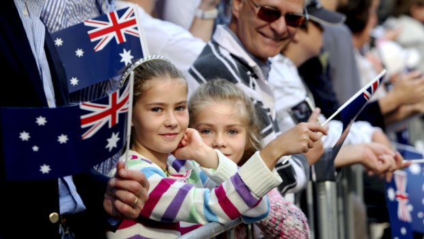 People watch the Anzac Day march in Sydney.