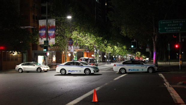 Police at the scene of the shooting of Michael Ibrahim on Macquarie Street on Sunday night. 