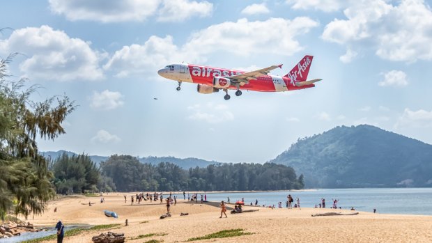 An AirAsia flight comes in for a landing at Phuket Airport.