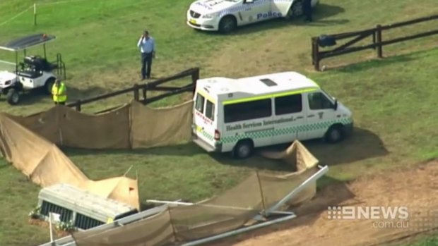 An ambulance at the scene of the accident where Caitlyn Fischer died competing in a cross-country event at the Sydney International Equestrian Centre.