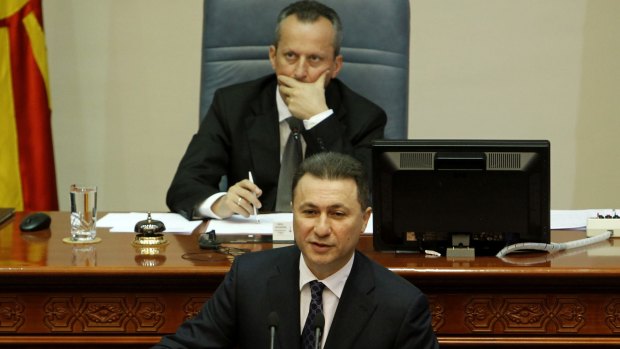 Macedonian Prime Minister Nikola Gruevski addresses the lawmakers in presence of the speaker Trajko Veljanovski, top.