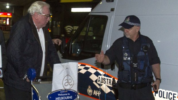 Andrew McManus being detained by police in Melbourne on Thursday night.