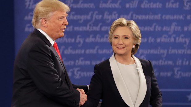 Hillary Clinton shakes hands with Donald Trump during the second presidential debate.