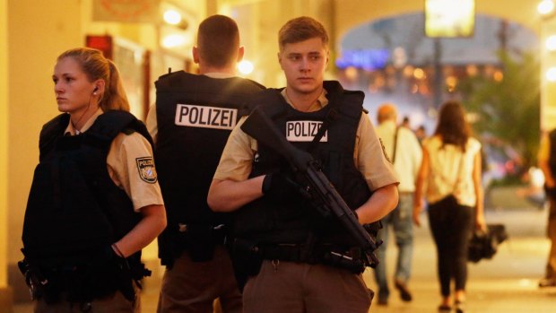 Armed police guard the downtown pedestrian zone in Munich following a rampage shooting in the city.