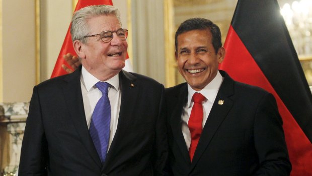 German President Joachim Gauck (L) and Peru President Ollanta Humala smile during a ceremony at the government palace in Lima last month. 