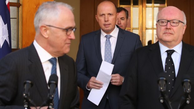 George Brandis with Peter Dutton, centre, and Malcolm Turnbull  announcing the new Home Affairs ministry in July.