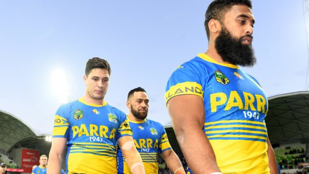 So close, yet so far: The Eels trudge off the field after pushing the Storm to the limit.