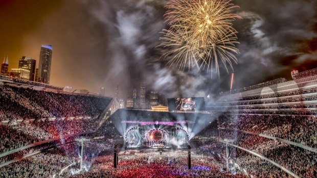 Fireworks explode as veteran rock band The Grateful Dead perform during the second day of their last three concerts at Soldier Field stadium in Chicago.