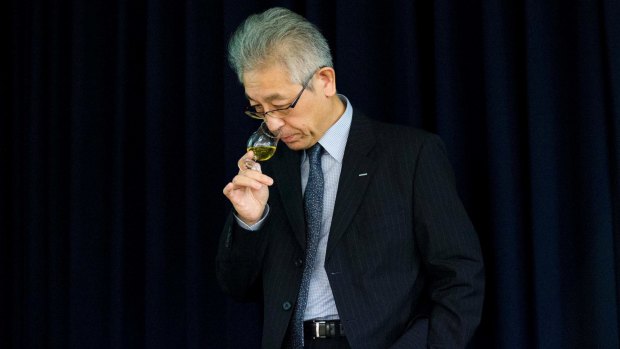 Suntory's chief blender Shinji Fukuyo samples whisky during a presentation of Suntory Holdings' whiskies in Tokyo.