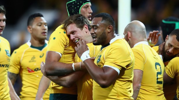 Great Dane: The Wallabies celebrate a Dane Haylett-Petty try in the win over Argentina in Perth.
