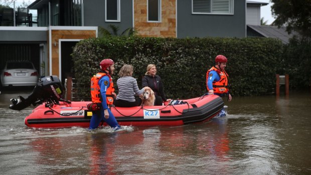 Residents evacuate their homes  as rising waters inundate Narrabeen Street, Narrabeen.  