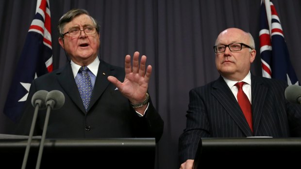 David Irvine (left), head of ASIO, and George Brandis both want metadata stored for fighting terrorism and crime.