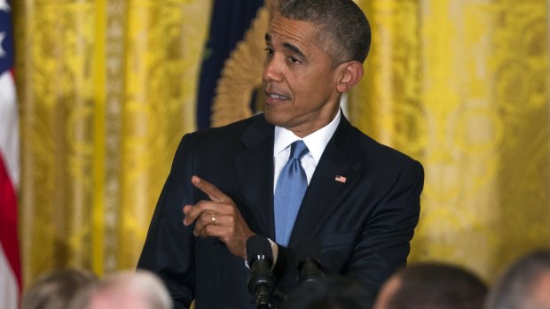 Barack Obama reacts to a heckler at the White House.