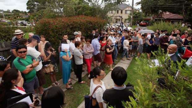 A crowd of mainly Chinese buyers at a hot auction in Sydney.