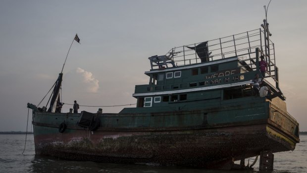 A boat that carried Rohingya and Bangladeshi migrants, now abandoned in Kuta Binie, Indonesia.
