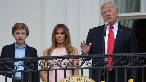 President Donald Trump with first lady Melania Trump and their son Barron during the annual White House Easter Egg Roll at the White House.