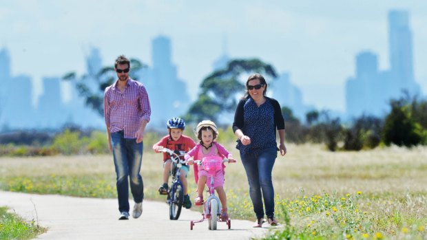 Jason, William (seven), Lucy (four) and Alice Osborne enjoy living and the bike tracks surrounding Point Cook.