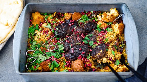 Mixed grains form the base of this Persian lamb and torn falafel one-tray wonder.