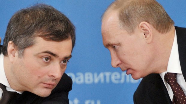 Russian Prime Minister Vladimir Putin, right, speaks to Vladislav Surkov, then-deputy prime minister in charge of economic modernisation.