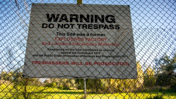 A sign at the entrance to the contaminated site. 