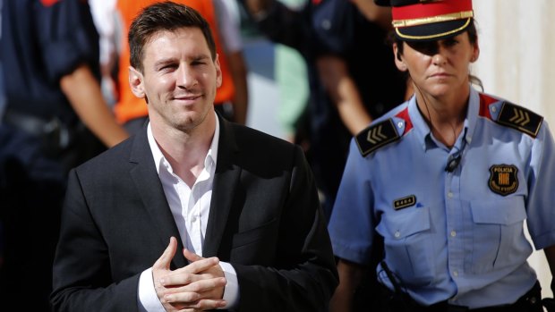 Lionel Messi arrives at a court to answer questions in the tax fraud case in Gava, near Barcelona, in 2013.