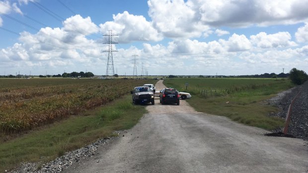 Police cars arriving at the scene of the hot air balloon crash near Lockhart, in Texas.