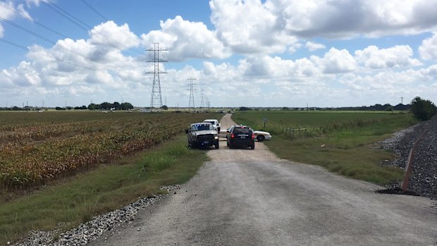 Police cars arriving at the scene of the hot air balloon crash near Lockhart, in Texas.