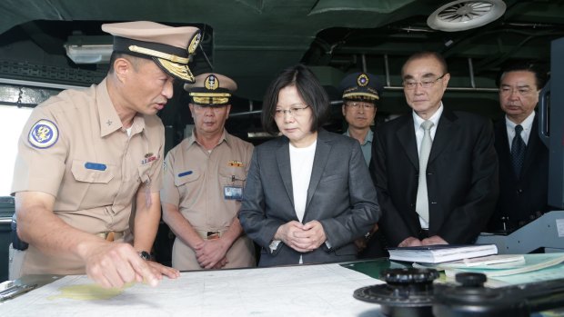 Taiwan's President Tsai Ing-wen (centre) reviews nautical charts aboard a Taiwan Navy ship. A new book claims Taiwan and China are the real Asian flashpoint, not North Korea.