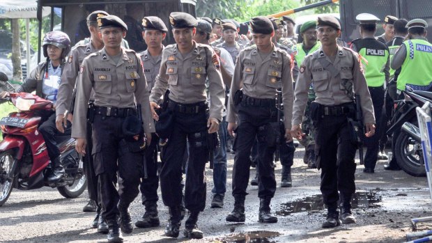 Soldiers and police arrive at Cilacap, the port of departure for Nusakambangan, where the executions will take place.