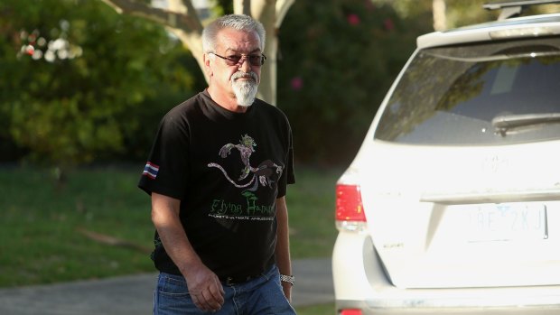 A man arrives at the Ristevkis' Avondale Heights home on Tuesday.
