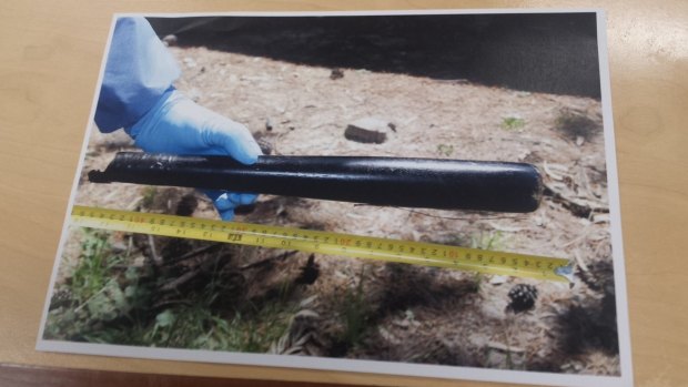 A police photo of the baseball bat, which detectives say was used to fatally bash Mark Emmanuel Spencer.
