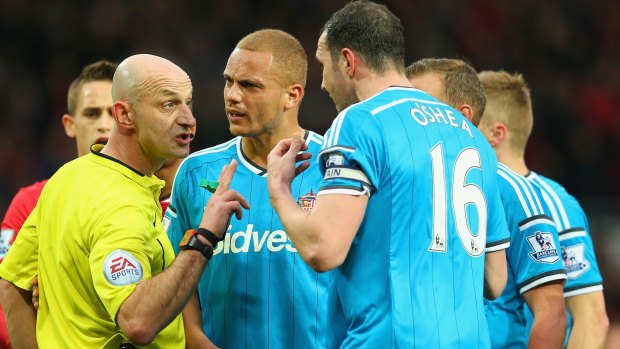 Seeing red: Wes Brown argues with the referee after being shown a straight red card instead of his teammate John O'Shea.